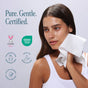 A woman in a white tank top gently wipes her face with a white cloth, seamlessly incorporating Cliganic Clean Face Towel XL - Ultra Absorbent & Durable into her skincare routine. Text reads Pure. Gentle. Certified. Symbols highlight that these disposable face towels are cruelty-free, OEKO-TEX certified, fragrance-free, hypoallergenic, and safe for sensitive skin—making them the perfect choice for daily care.