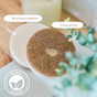 Two round, plastic-free dish sponges from Scrub Be Love’s Round Heart Dish Sponge 4-Pack are stacked: a coconut coir sponge with a heart cutout on top and a white wood pulp cellulose sponge below. Both feature a Plant Based icon.