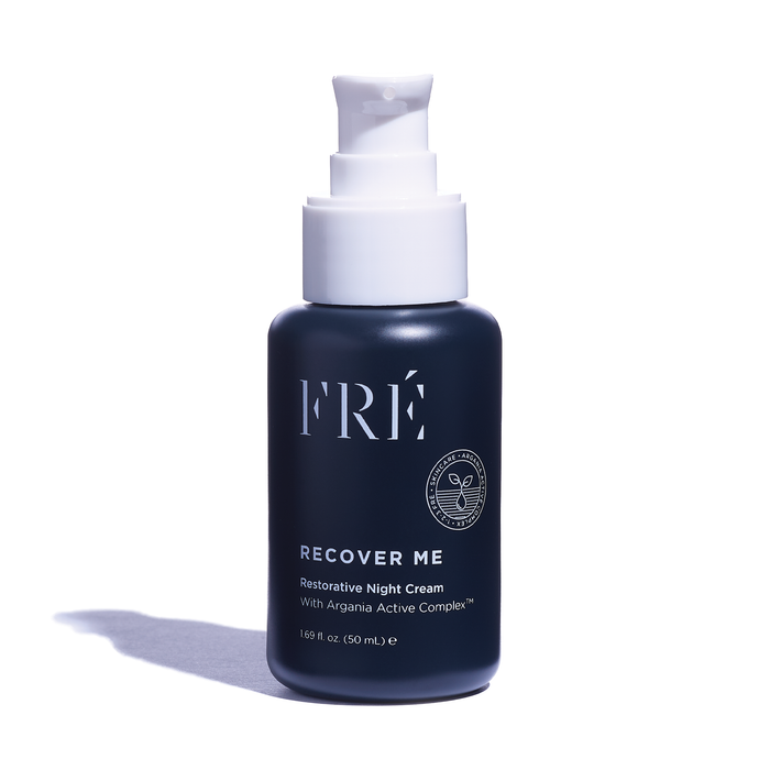 A dark blue bottle of FRÉ Recover Me Restorative Night Cream with a white pump dispenser, shown on a white background with a soft shadow. The bottle holds 1.69 fl oz (50 mL).