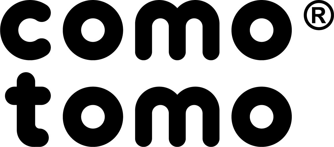 Black text logo with the words como tomo in lowercase, rounded letters on a white background. The “co” in “como” is stacked above “to” in “tomo.” A registered trademark symbol is at the top right.