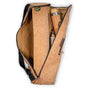 The Yoloha Yoga Cork Yoga Mat Carrier unzipped, revealing a rolled yoga mat, a reusable bottle, and a spray bottle—all neatly organized within the bag’s compartments. Crafted from natural cork, this stylish mat carrier from Yoloha Yoga offers eco-friendly organization for every practice.