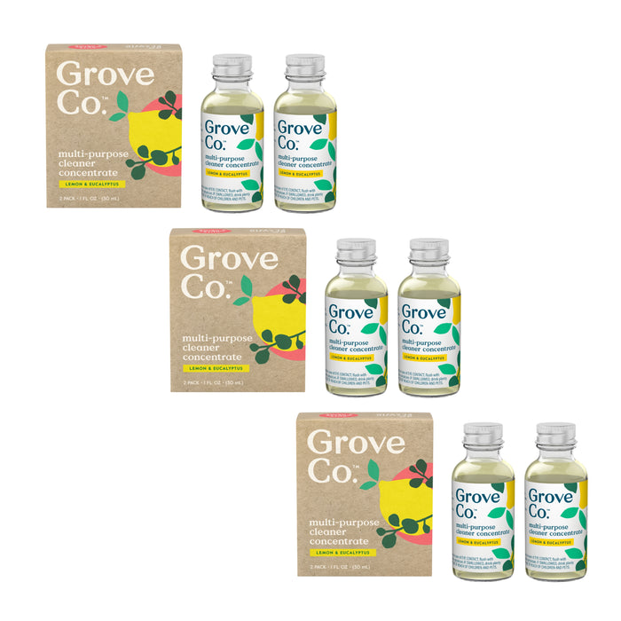 The Grove Co. Multi-Purpose Cleaner Concentrates 3-pack is showcased, each with two glass bottles of yellow liquid and a brown cardboard box labeled Lemon & Eucalyptus, decorated with green leaf and lemon designs.