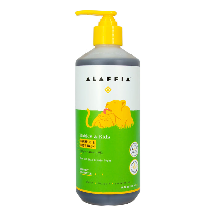 A bottle of Alaffia Babies & Kids Shampoo & Body Wash with coconut chamomile scent. The label features a yellow illustration of a lion and cub on a green background and a yellow pump dispenser on top.