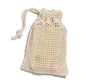The Peach Soap Saver Bag, a cream-colored, GOTS-certified cotton mesh design with a secure drawstring, holds a bar of soap. Its loose weave displays the light soap inside, ideal for rich lather and exfoliation.