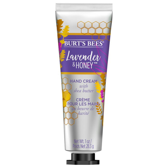 A silver tube of Burt’s Bees Lavender & Honey hand cream with shea butter, decorated with gold and purple leaves and honeycomb patterns. The tube contains 1 oz (28.3 g) of product.