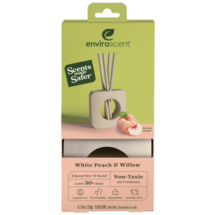 A box of Enviroscent White Peach & Willow non-toxic air freshener with 4 scent sticks and a holder. The packaging features a peach illustration and claims of safety, pet friendliness, and being recyclable.