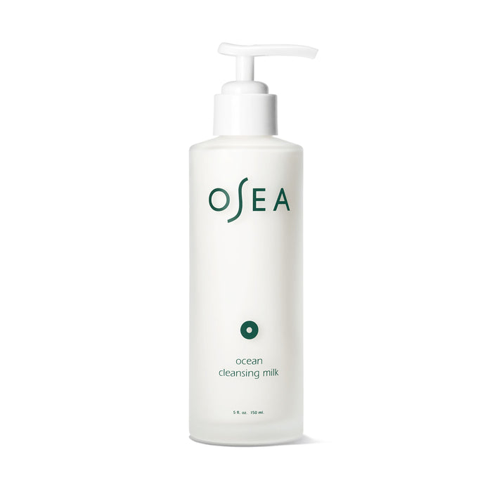 A white pump bottle labeled “OSEA” contains ocean cleansing milk. The minimalist design features green text and a small circular icon, with the bottle holding 5 fl oz (150 ml) of product.
