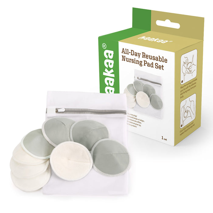 A set of gray and white reusable nursing pads displayed with a white zippered pouch, next to a green and yellow box labeled All-Day Reusable Nursing Pad Set featuring product images and instructions.
