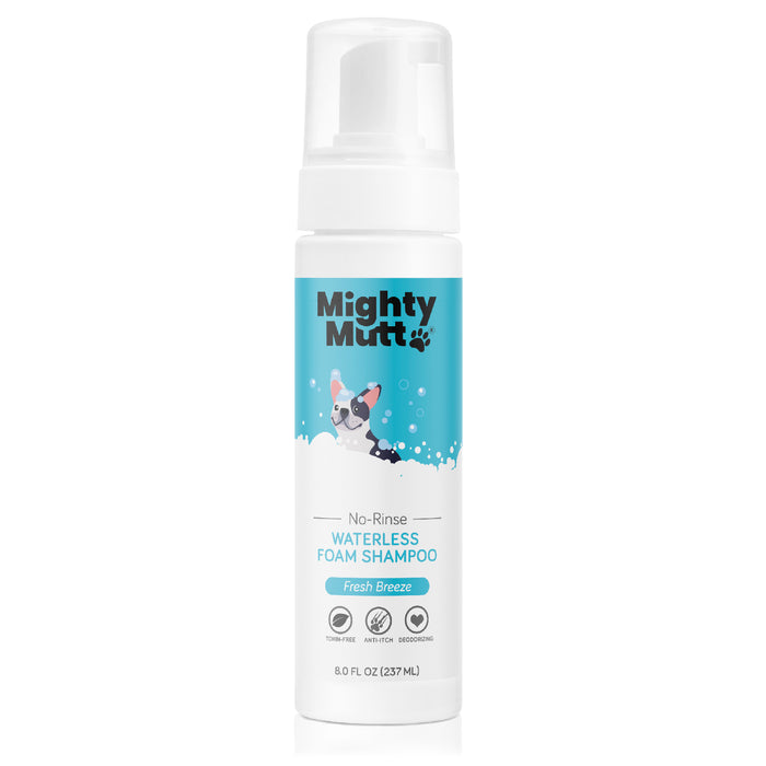 A bottle of Mighty Mutt No-Rinse Waterless Foam Shampoo for dogs, labeled Fresh Breeze. The white bottle features a cartoon dog in bubbles and has an 8 fl oz (237 ml) capacity.