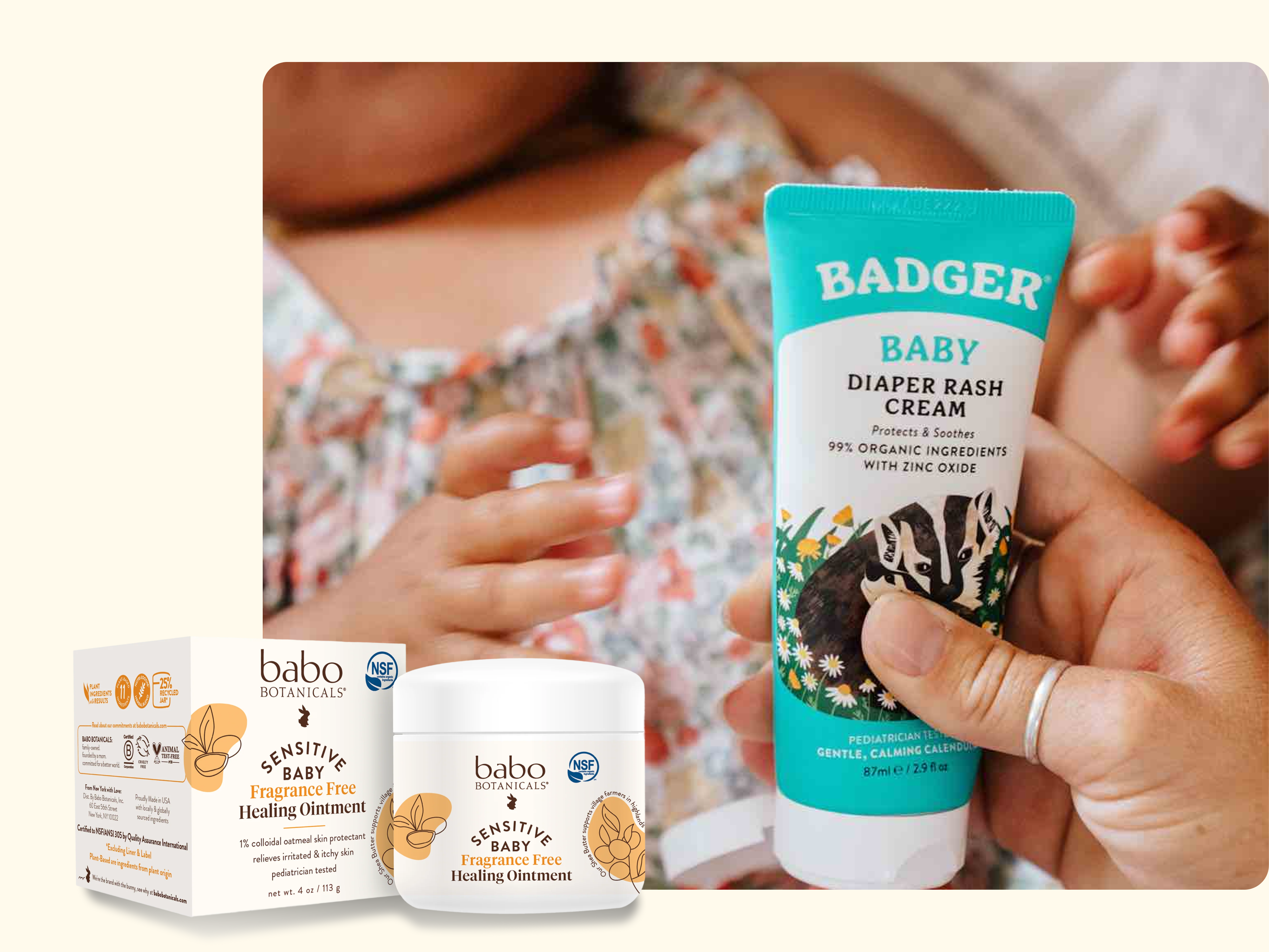 A hand applies Badger Baby Diaper Rash Cream to a babys skin, with a jar and box of Babo Botanicals Sensitive Baby Healing Ointment in the foreground.