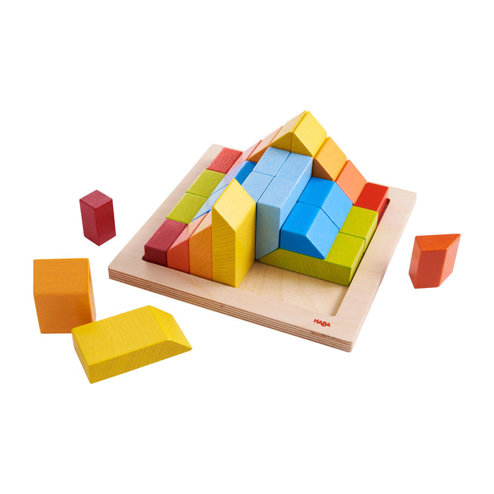 Colorful wooden blocks arranged as a pyramid on a square wooden base, with some blocks in red, yellow, blue, and orange positioned around the base.