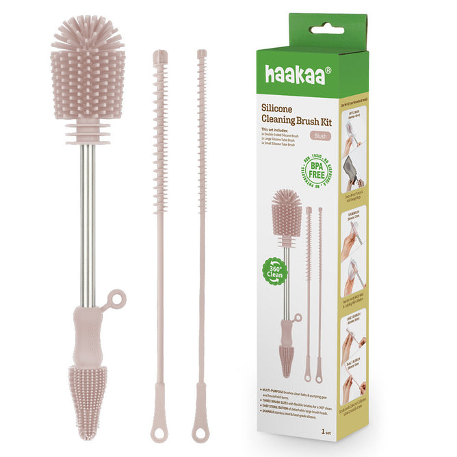 Haakaa Silicone Cleaning Brush Kit with three pink silicone brushes of varying sizes and a green-and-white box displaying the product name, BPA-free label, and images showing the brushes in use.