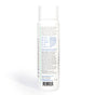 A white cylindrical bottle with text and icons on the label, highlighting product features like vegan, cruelty free, and no sulfates. Ingredients and usage directions are printed in small text on the back.