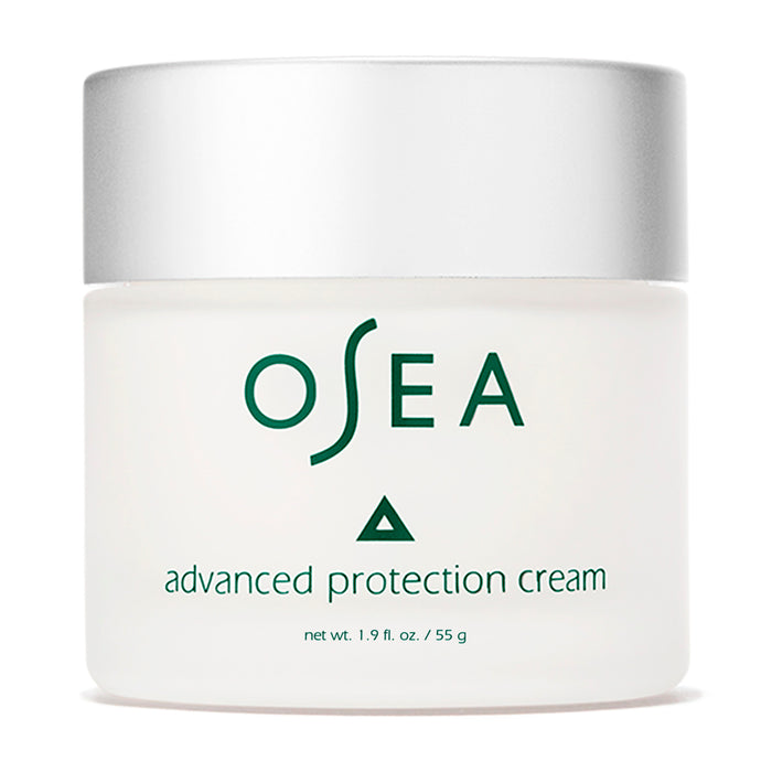 A white jar with a silver lid labeled OSEA advanced protection cream in green text, containing 1.9 fl. oz. (55 g) of product.