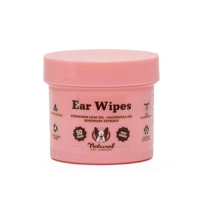 A pink container labeled Ear Wipes for dogs, featuring information about ingredients like cinnamon leaf oil and calendula oil, and stating it contains 50 wipes. The container displays icons for being hypoallergenic and recommended by vets.
