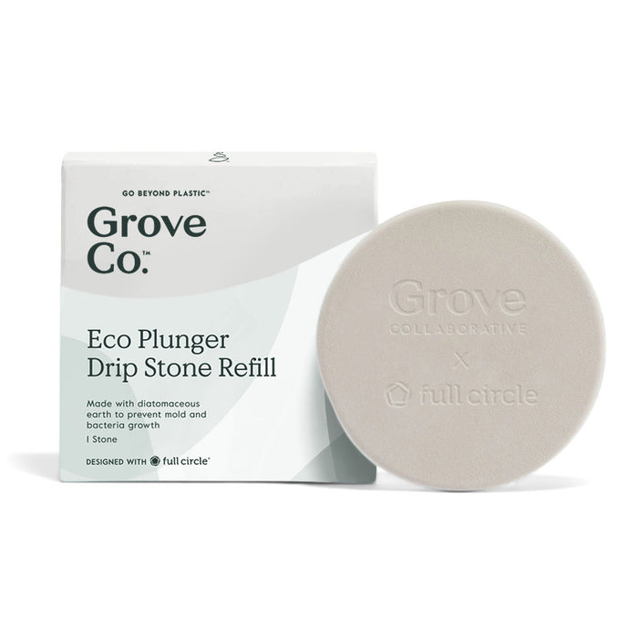 A white box labeled “Grove Co. Eco Plunger Drip Stone Refill” sits beside a round, light beige stone with “Grove Collaborative x full circle” embossed on it. The packaging highlights eco-friendly features.