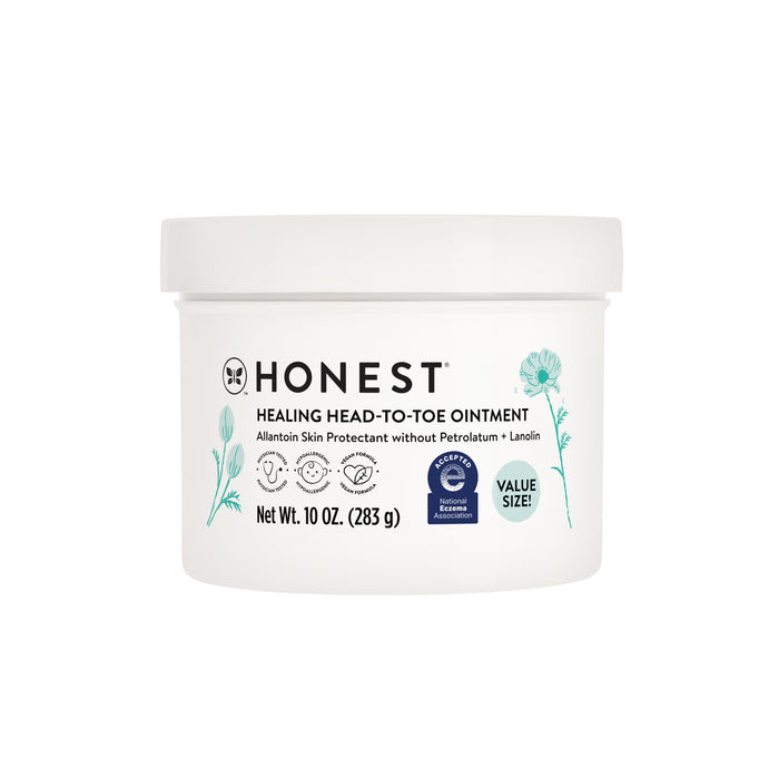 A white container of Honest Healing Head-to-Toe Ointment, 10 oz, featuring blue floral illustrations and product details on the label, including “value size” and “National Eczema Association Accepted” symbols.