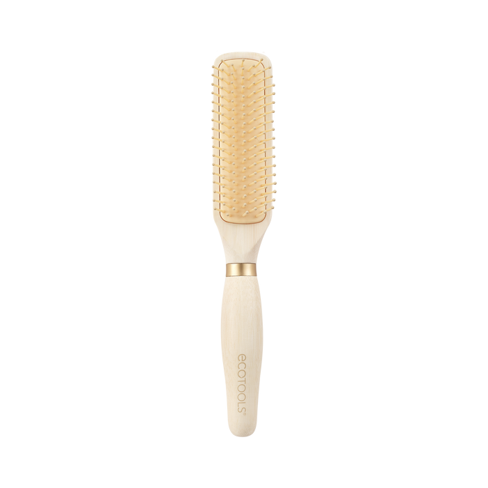A wooden hairbrush with a rectangular paddle, beige bristles, and a light wood handle featuring the ecotools logo, set against a plain white background.