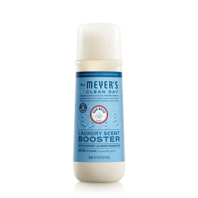 A blue and white 18 oz bottle of Mrs. Meyer’s Laundry Scent Booster, featuring Compassion Flower fragrance, comes with a white cap and eco-friendly ingredients for a refreshing laundry experience.