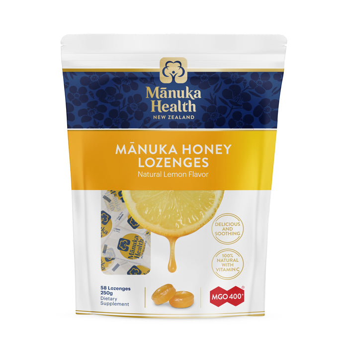 A package of Mānuka Health New Zealand Mānuka Honey Lozenges, natural lemon flavor. The front shows lozenges, a lemon slice with honey, and product details such as MGO 400+ and 58 lozenges.