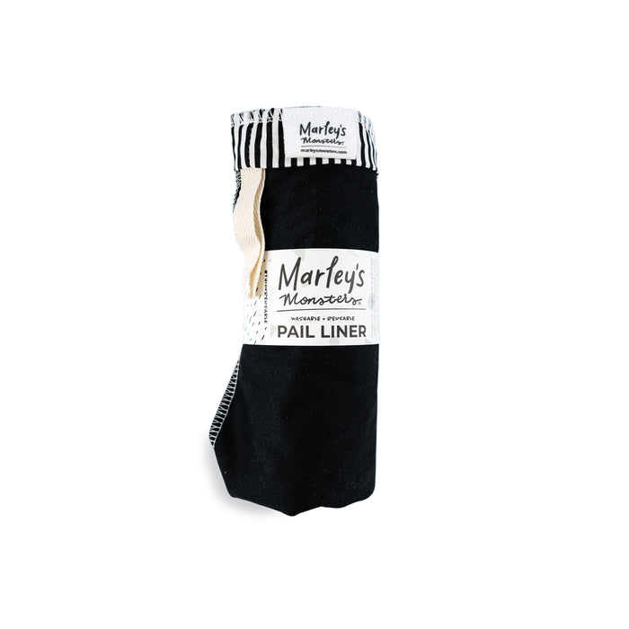 A rolled black pail liner with a label that reads Marleys Monsters Washable & Reusable Pail Liner against a white background. The liner has a black and white striped trim at the top.