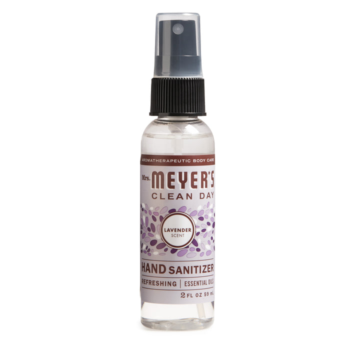 A 2 fl oz spray bottle of Mrs. Meyers Clean Day Hand Sanitizer in lavender scent, featuring a purple label with lavender illustrations and a clear plastic cap.