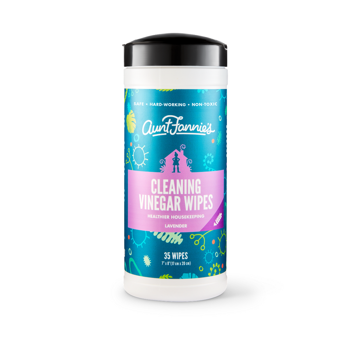 A cylindrical container of Aunt Fannies Cleaning Vinegar Wipes stands against a white background. The blue and pink label reads Lavender and 35 Wipes, emphasizing its non-toxic formula and biodegradable materials for healthier housekeeping with natural cleaning wipes.