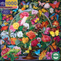 The eeBoo Piece & Love Butterfly Still Life 1000 Piece Puzzle displays Naomi Devil’s vivid still life of colorful flowers and butterflies under a glass cloche, with swirling green leaves and bright pink, yellow, orange, and red blossoms.