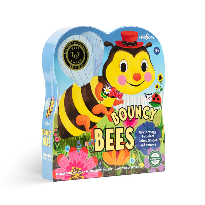 The eeBoo Piece & Love Bouncy Bees Shaped Game for ages 3+ comes in a colorful box with a smiling bee in a red hat, flowers, ladybug, and butterfly. Highlights strategy and learning colors for kids.