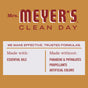 Mrs. Meyers Room Freshener logo on a gold background; below, a chart lists Made with essential oils—ideal for an apple cider scent—and Made without parabens, phthalates, propellants, or artificial colors.