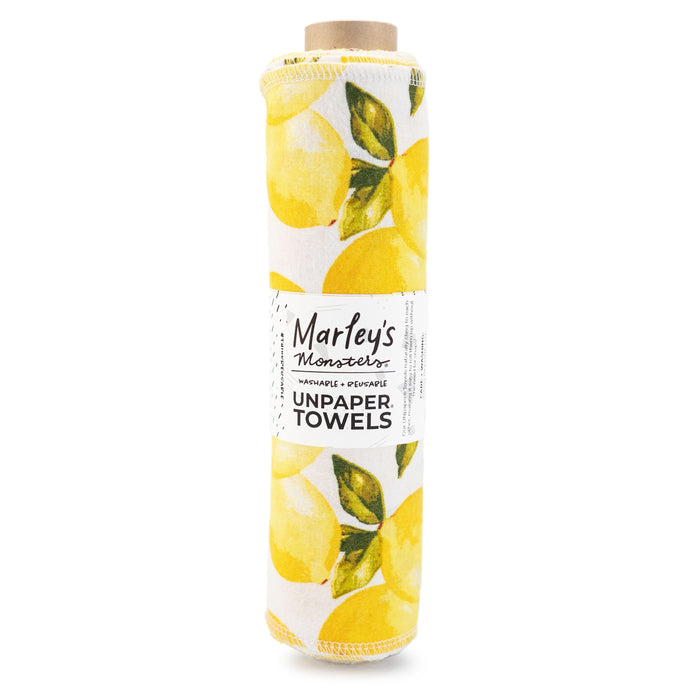 A rolled pack of Marleys Monsters Unpaper Towels with a bright yellow lemon and green leaf pattern on white fabric. The label is wrapped around the roll, displaying the brand and product name.