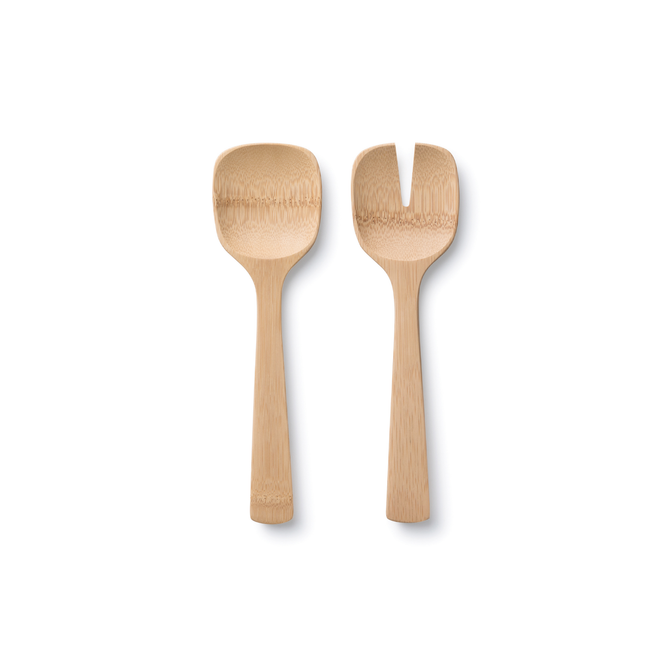 The Bambu Short Servers, crafted from organic bamboo, include a flat spoon with a shallow bowl and a modern fork with a split tip. Both feature short, rounded handles and rest stylishly on a white background.