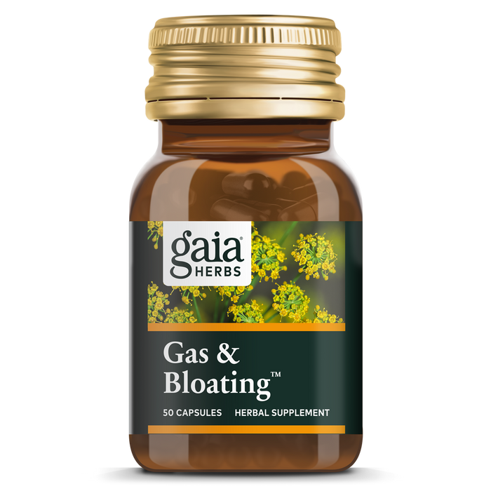 A brown bottle of Gaia Herbs Gas & Bloating herbal supplement with a gold cap, containing 50 capsules. The label features a close-up image of yellow flowering herbs.