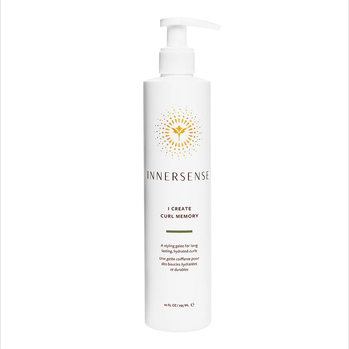 A white bottle with a pump labeled Innersense I Create Curl Memory, described as a styling gelée for long-lasting, defined curls, with gold sunburst design above the brand name.