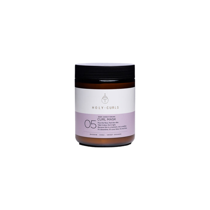 A brown jar with a black lid labeled Holy Curls 05 Curl Mask. The label is white and lavender, featuring product details and branding. The jar is centered on a plain white background.