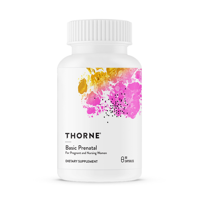 A white bottle of Thorne Basic Prenatal dietary supplement with a white cap, featuring abstract pink and gold artwork on the label. The bottle contains 90 capsules and is designed for pregnant and nursing women.