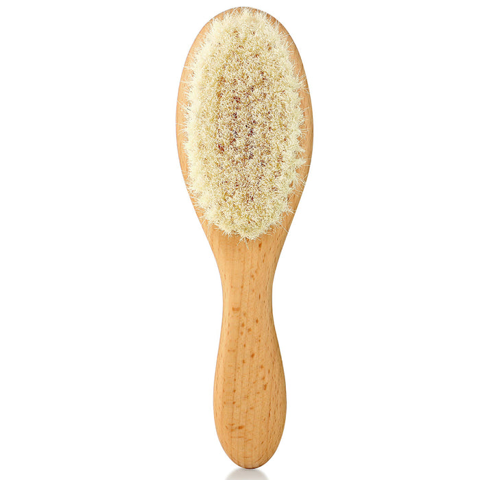 A wooden-handled brush with soft, light-colored bristles, shown against a white background. The brush is oval-shaped and appears to be designed for gentle grooming or care.