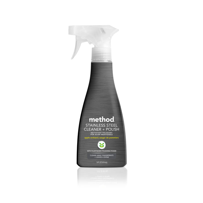 A spray bottle of Method Stainless Steel Cleaner + Polish, featuring a gray label with white text and a clear spray nozzle, standing upright on a white background.