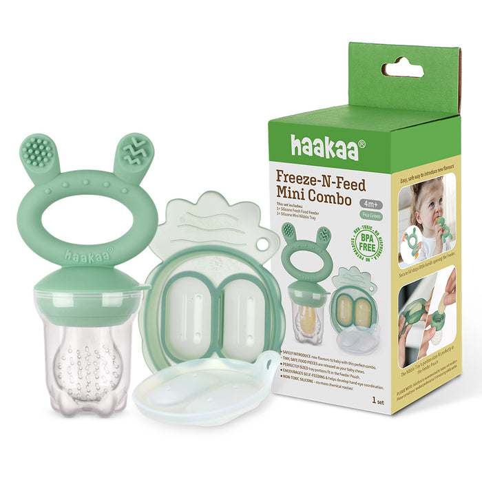 Haakaa Freeze-N-Feed Mini Combo set with green silicone feeder, matching lid, case, and retail box showing product details and a baby using the feeder.