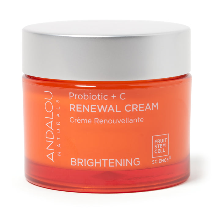 An orange jar of Andalou Naturals Probiotic + C Renewal Cream with white text highlighting its brightening and fruit stem cell features. The jar has a white lid and bilingual English-French labeling.