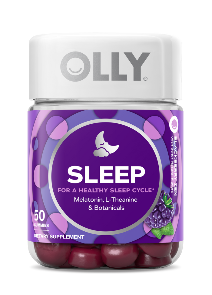 A bottle of OLLY Sleep gummies, featuring a purple label with a moon icon. The label highlights melatonin, L-theanine, and botanicals, and shows blackberries and purple flowers. The bottle contains 50 gummies.