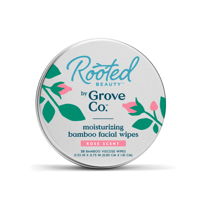 A round tin labeled Rooted Beauty by Grove Co. moisturizing bamboo facial wipes, rose scent, with pink and green floral illustrations. The tin contains 35 bamboo viscose wipes.