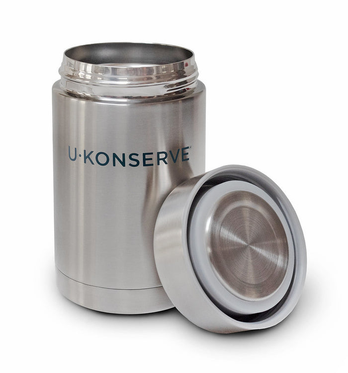 A stainless steel insulated food jar with the brand name U Konserve printed on it, shown with its lid removed and placed beside it.