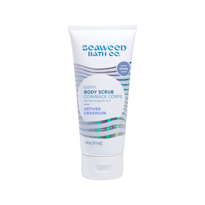 A white tube of Seaweed Bath Co. Calm Body Scrub with vetiver and geranium, featuring blue and purple accents, 6 fl oz (177 mL). The label highlights sea kelp and glycolic acid.