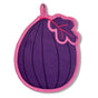 The Neighborgoods Pot Holder - Fig: a playful, purple fig-shaped cotton pot holder with pink trim, hanging loop, and dark purple/pink leaf detail—an essential kitchen accessory, shown on a white background.
