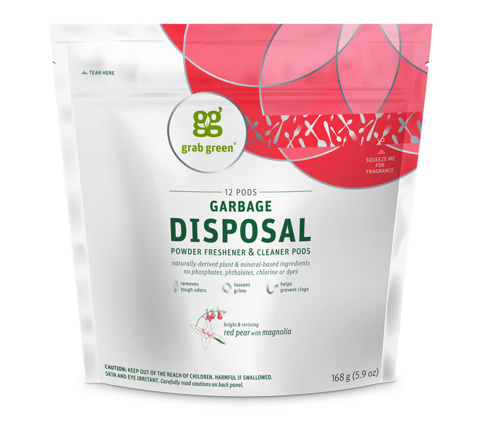 A white and pink resealable pouch labeled grab green Garbage Disposal Powder Freshener & Cleaner Pods with red pear and magnolia scent. The bag contains 12 pods and highlights being free of phosphates, phthalates, chlorine, and dyes.