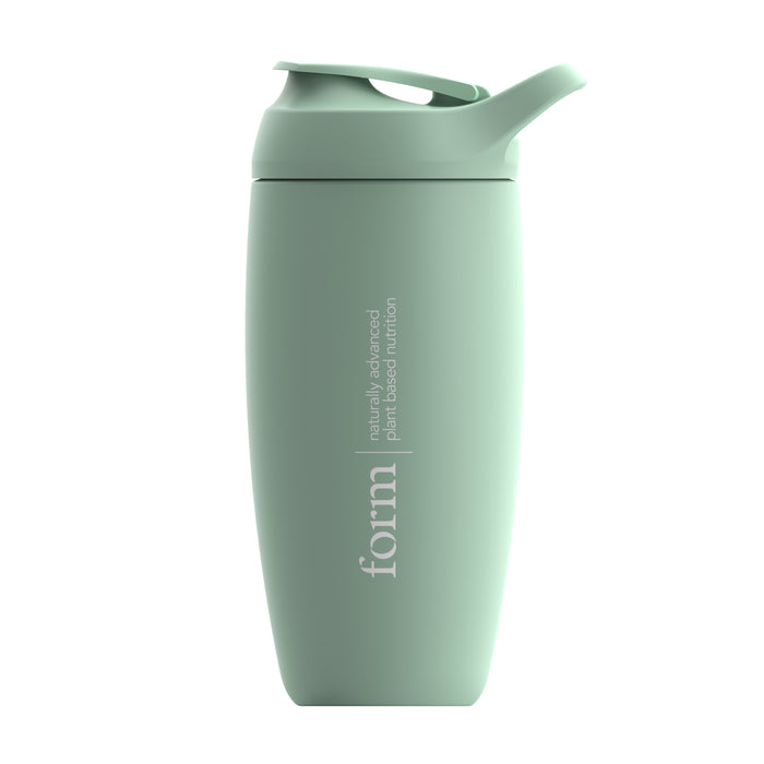 A light green reusable shaker bottle with a flip-top lid. The word form and the phrase naturally advanced plant-based nutrition are printed vertically on the front.