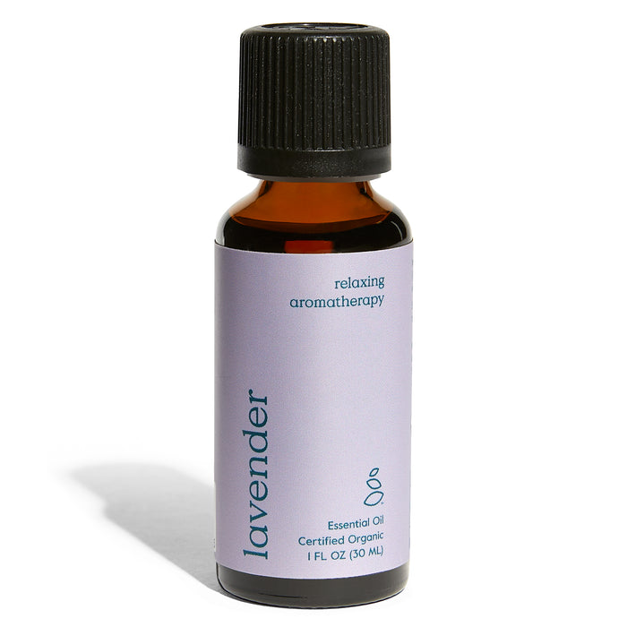 A small amber bottle with a black cap and a light purple label reading lavender, relaxing aromatherapy, essential oil, certified organic, 1 fl oz (30 mL).