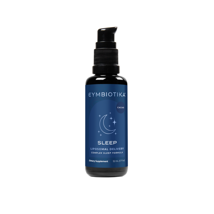 A bottle of Cymbiotika Sleep supplement with a pump dispenser, featuring a blue label with a crescent moon and stars design, and text indicating it is a cacao-flavored liposomal sleep formula.