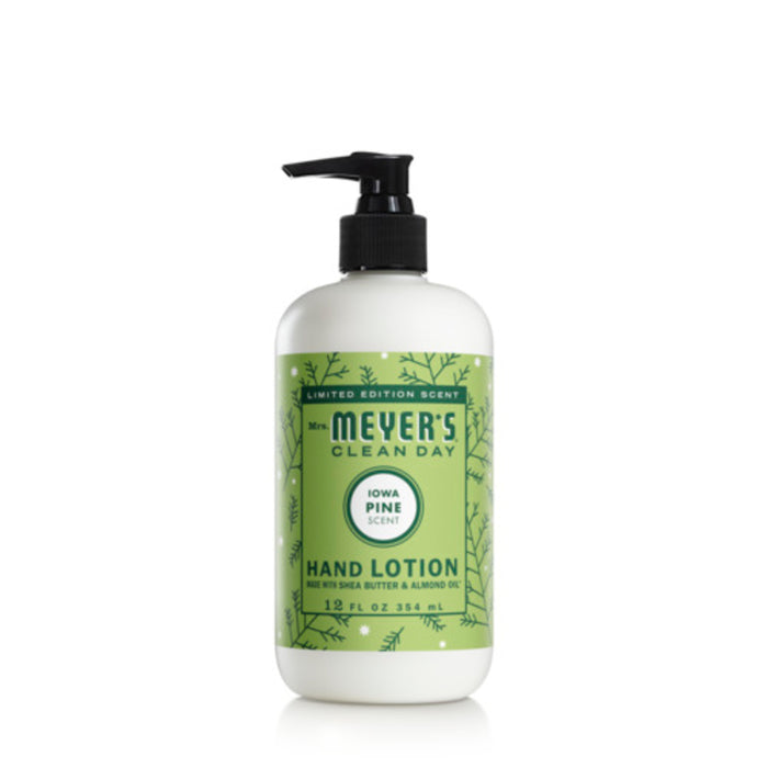 A bottle of Mrs. Meyers Clean Day hand lotion, Iowa Pine scent, with a green and white label featuring pine illustrations and a black pump top. The bottle is 12 fl oz (354 mL).